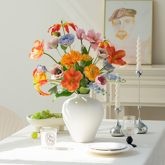 Cheerful Faux Tulips and Mixed Spring Flowers Arrangement in White Ceramic Vase - Bright Colors and Realistic Texture