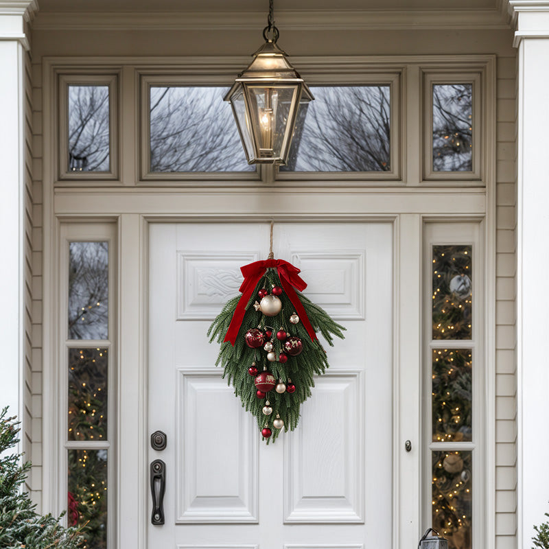 Festive Faux Pine Christmas Teardrop Swag with Red Ribbon and Ornaments - Cheerful and Inviting